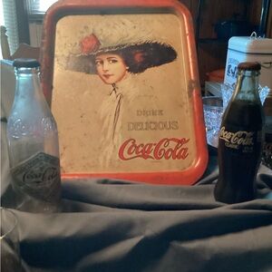 Coke tray and 2 Coke bottles.